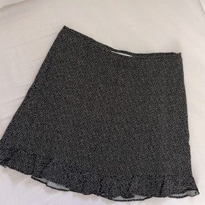 Black and white polka dot miniskirt with ruffle bottom.  Size M Abercrombie